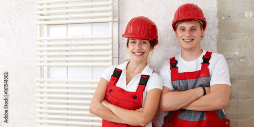 Young worker fixing up a house