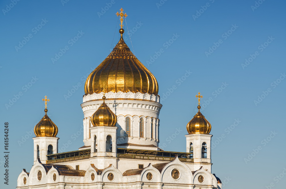 Fragment of Moscow Cathedral of Christ the Savior, Moskva river and embankment from Bolshoi Kamenny bridge in Moscow, Russia.