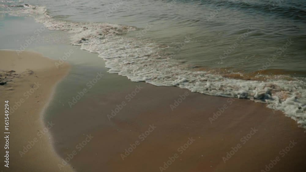 Beautiful view of the beach and sea waves in summer