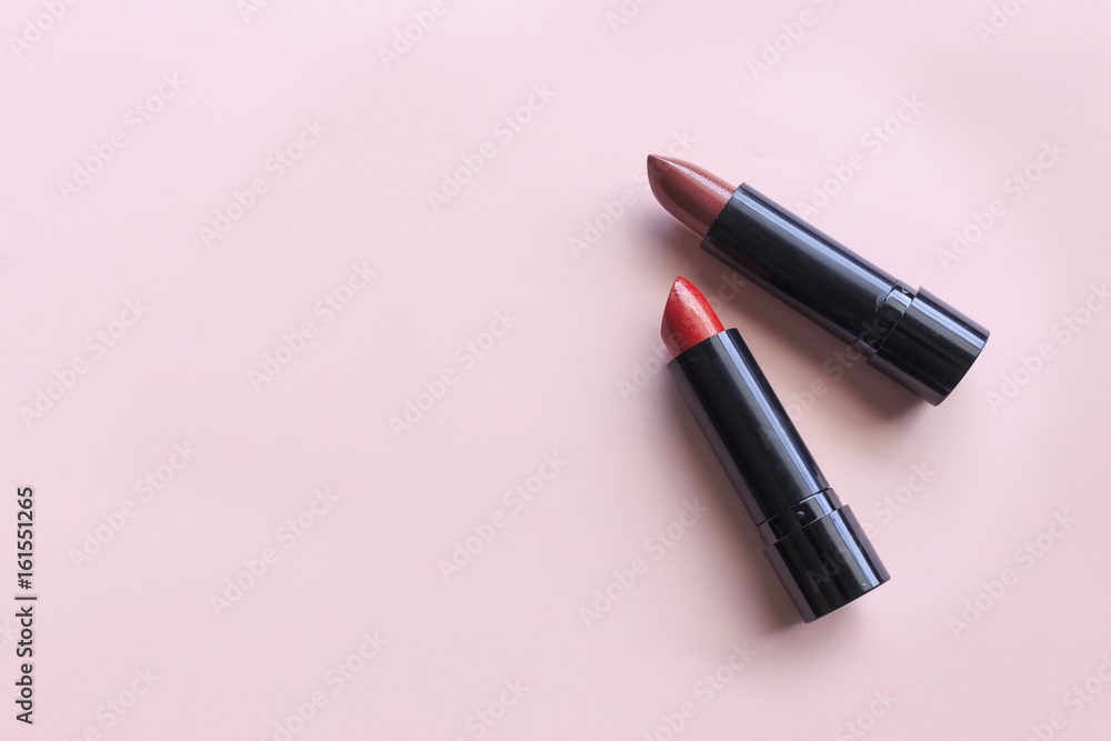 closeup lipstick on pink background. over light and sooft-focus closeup lipstick on pink background. over light and sooft-focus