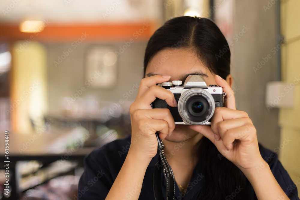 Asian woman taking a photo - obrazy, fototapety, plakaty 