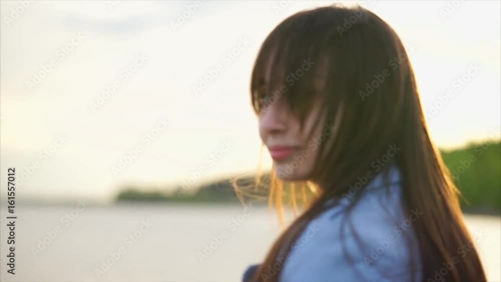 Beautiful caucasian woman close up view of her face. Sunlight and selective focus Beautiful caucasian woman close up view of her face. Sunlight and selective focus