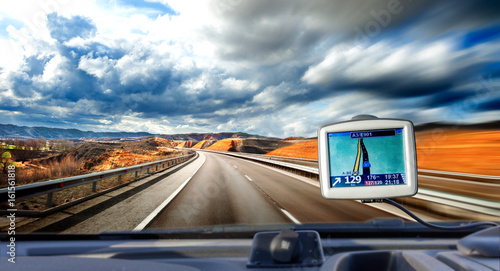 Gps display and travel concept. Road scenery towards the destination.Car travel and looking for the route concept