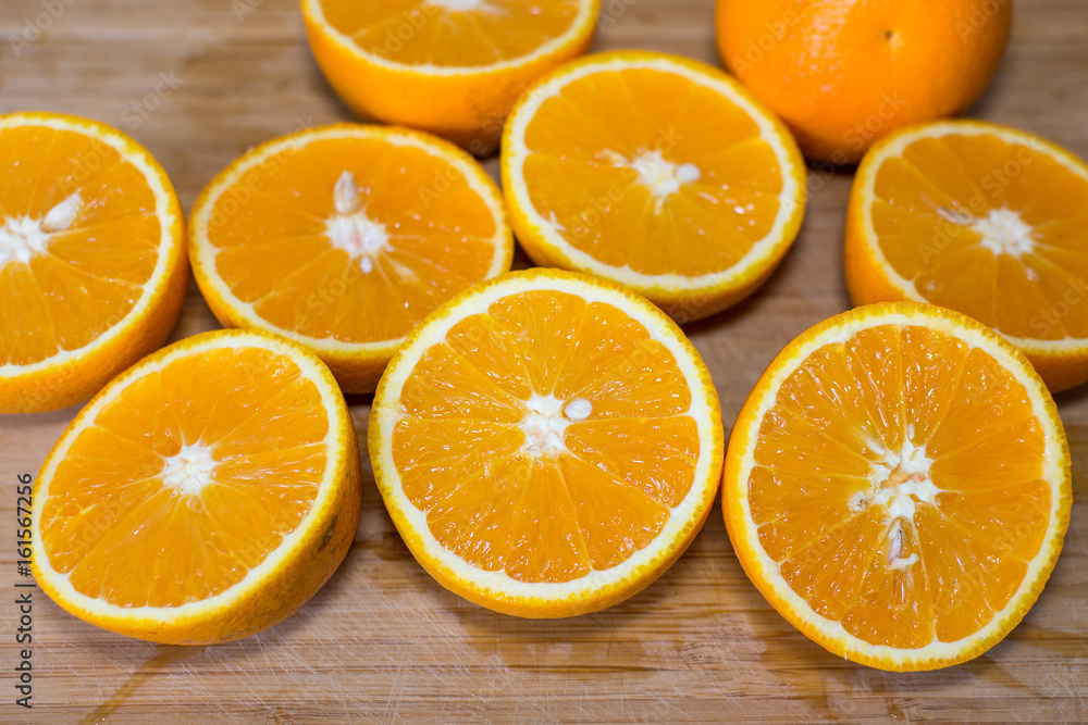 Sliced orange on a wooden board Sliced orange on a wooden board