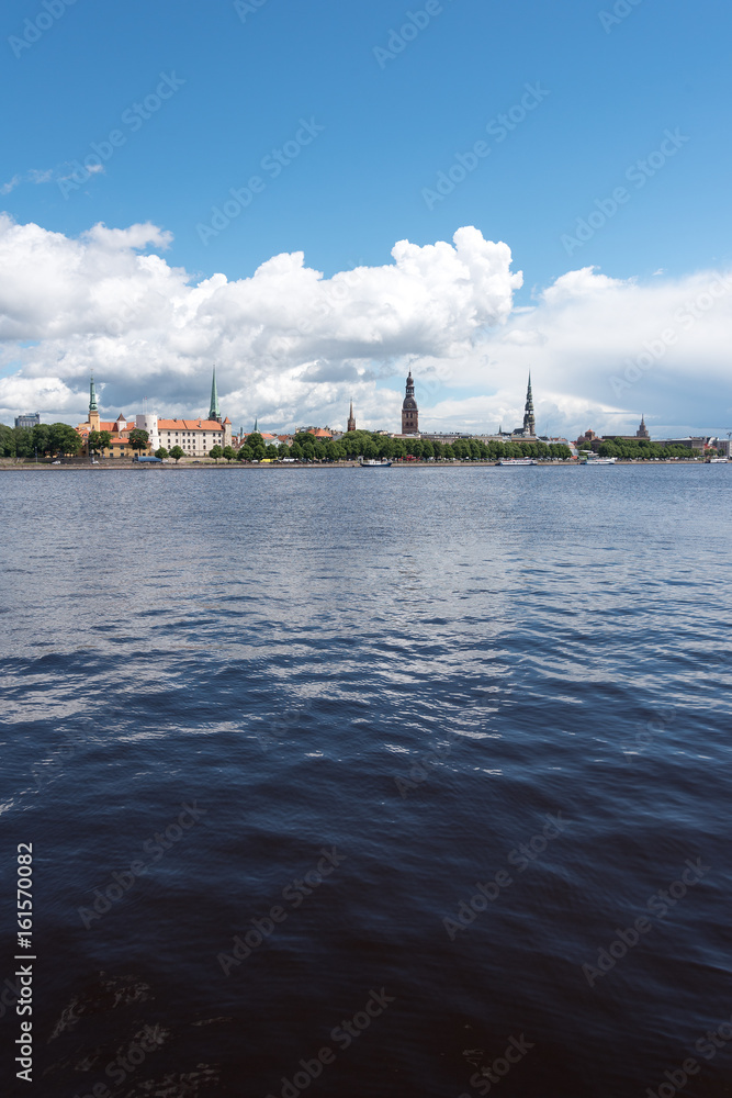 Riga city skyline across river Daugava, Latvia.