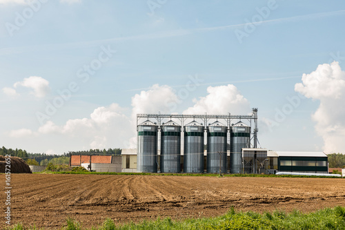 Elevator to store grain in a field on farmland