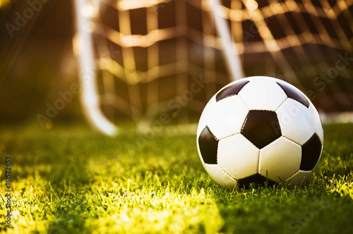 Fototapeta Naklejka Na Ścianę i Meble -  Closeup soccer ball on green grass