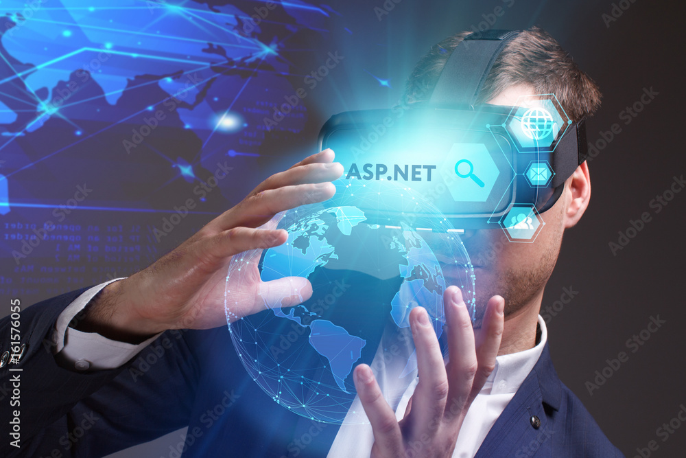 Business, Technology, Internet and network concept. Young businessman working on a virtual screen of the future and sees the inscription: ASP.NET