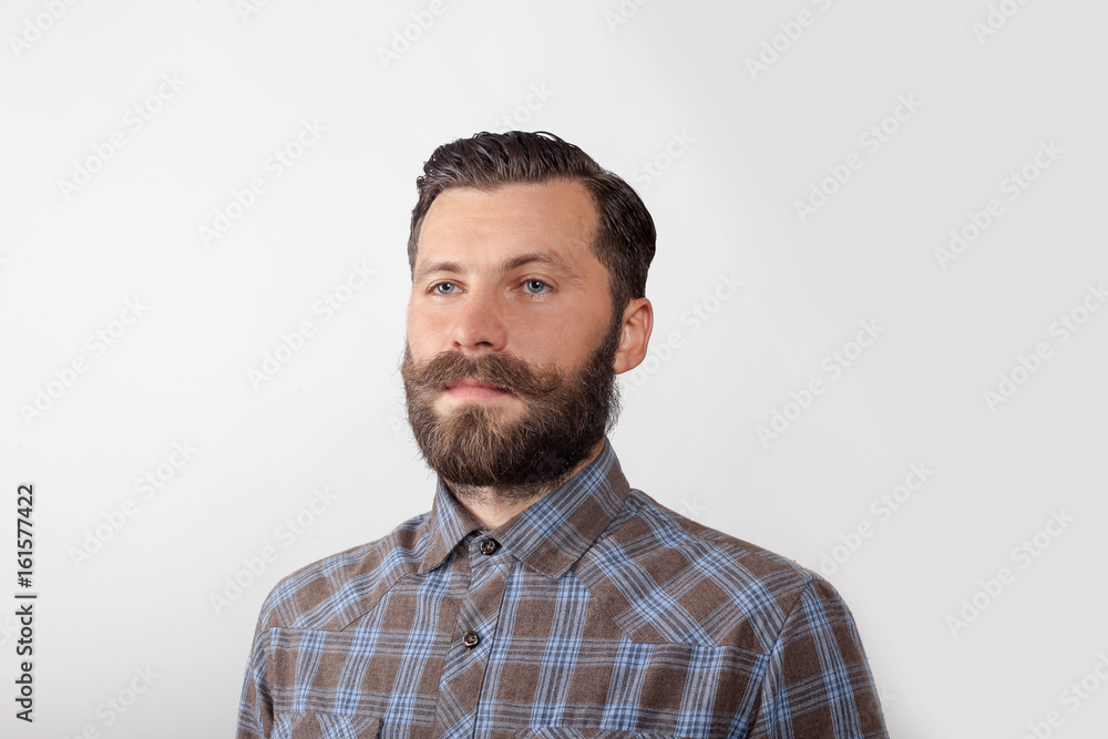 Obraz premium portrait of a young man with a beard and mustache