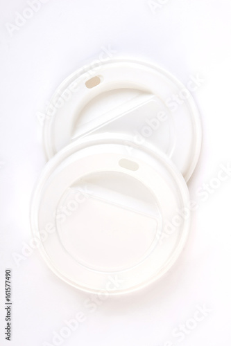 White disposable lids, top view. Caps for coffee container.