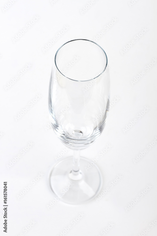 Empty clear champagne glass isolated. Wine glass on white background. Empty clear champagne glass isolated. Wine glass on white background.