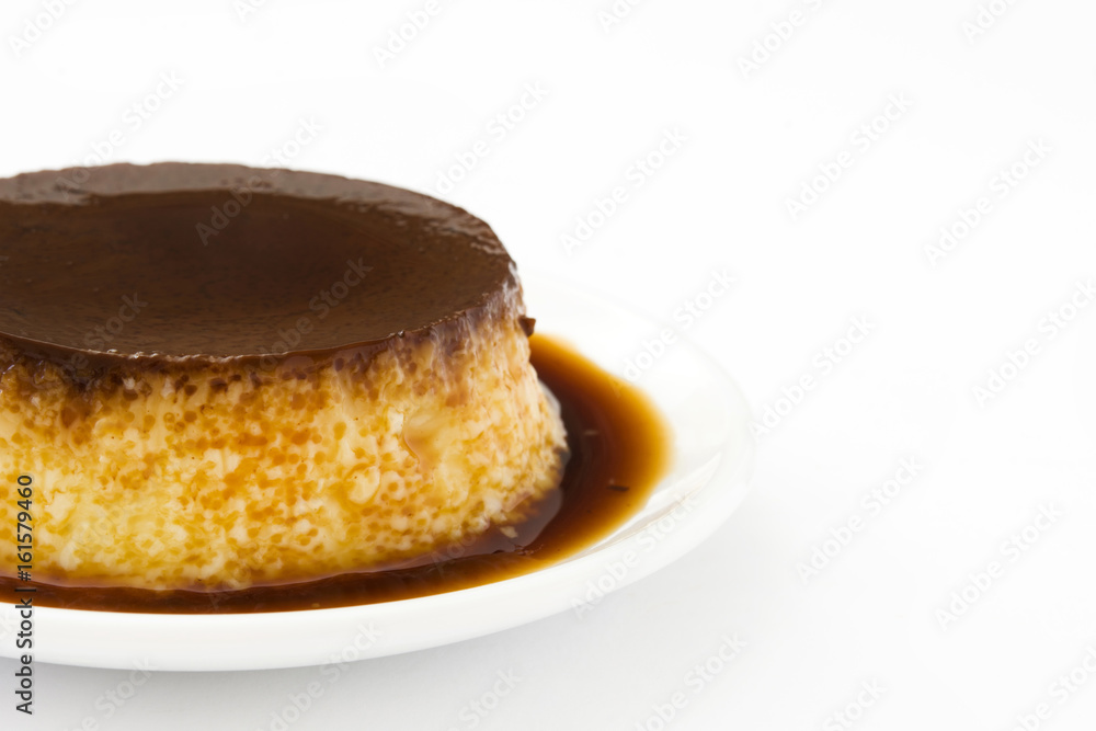 Creme caramel. Egg pudding isolated on white background
Creme caramel. Egg pudding isolated on white background