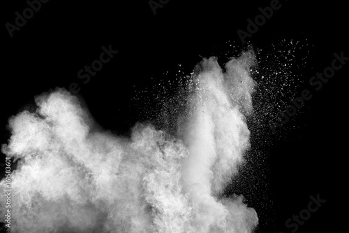 white Powder explosion on black background. White dust explode.
