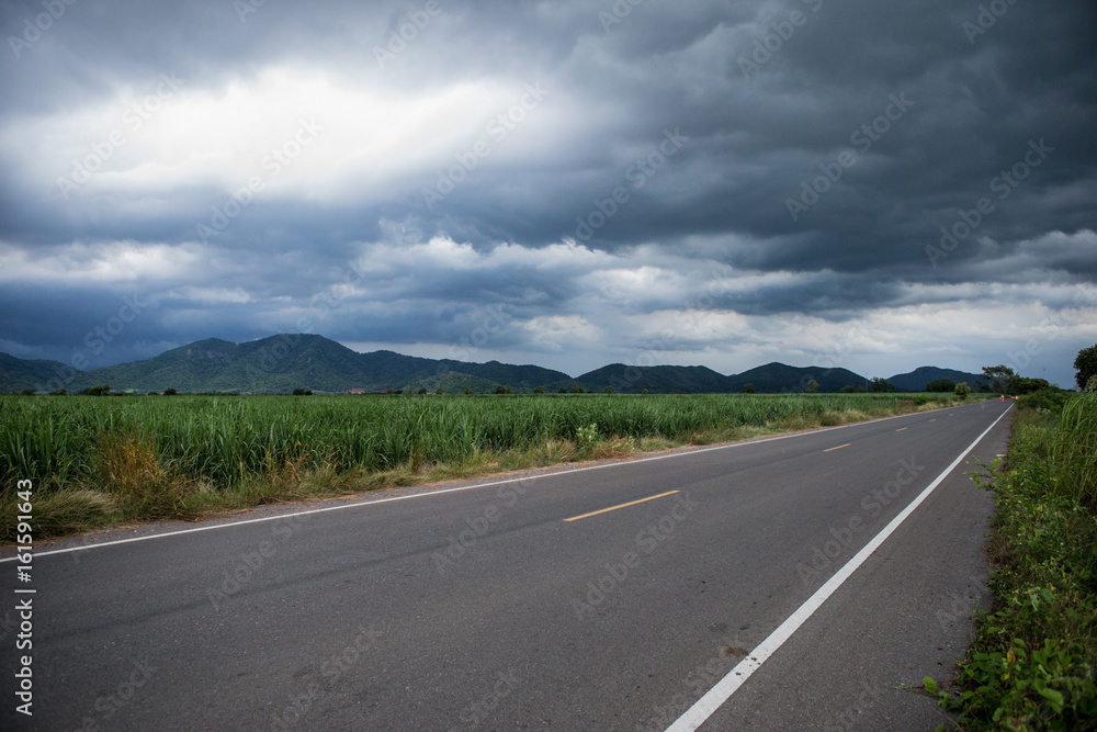 The sky before the storm on Paved asphalt road