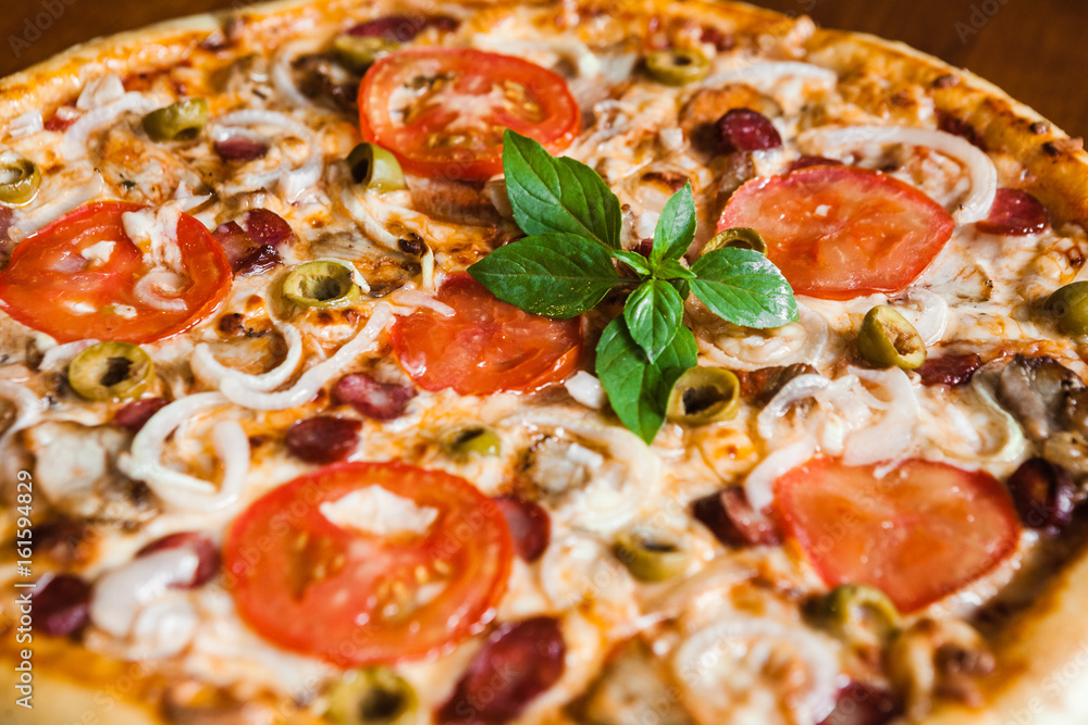 Delicious pizza with meat, cheese and mushrooms Delicious pizza with meat, cheese and mushrooms