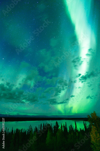 Wallpaper Mural Lake Reflects Aurora Borealis Emerging Through Clouds Remote Alaska Torontodigital.ca
