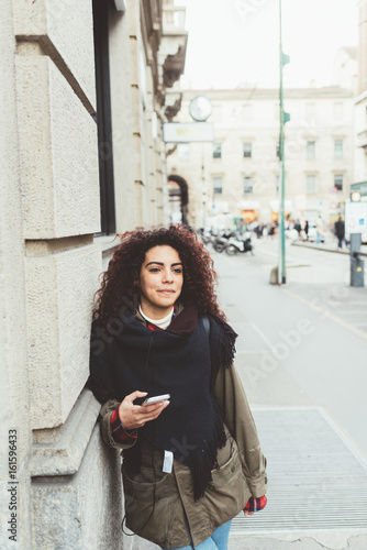 Young beautiful mixed race woman outdoor city using smart phone - technology, social network, communication concept © Eugenio Marongiu