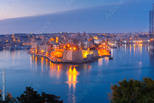 Wallpaper Mural Skyline aerial view of ancient Fort Saint Michael of Senglea peninsula and the Grand Harbor as seen from Valletta during morning blue hour, Malta. Torontodigital.ca