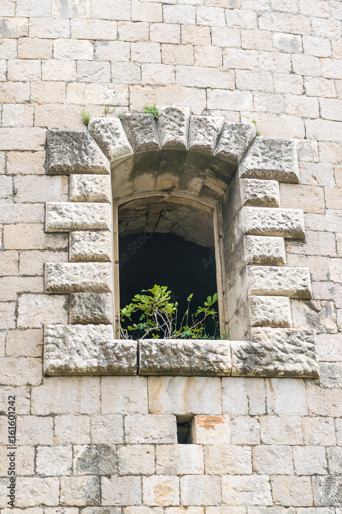 Windows in the stone walls of the fortress Mamula. Montenegro, Boka-Kotor Bay.