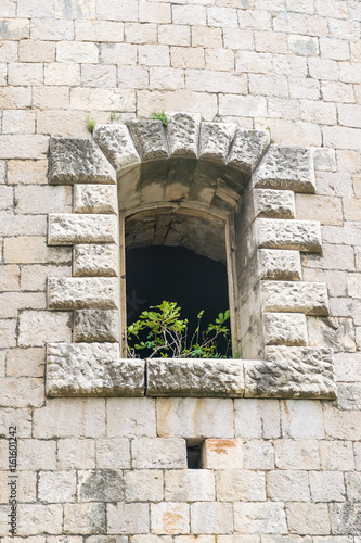 Windows in the stone walls of the fortress Mamula. Montenegro  Boka-Kotor Bay.