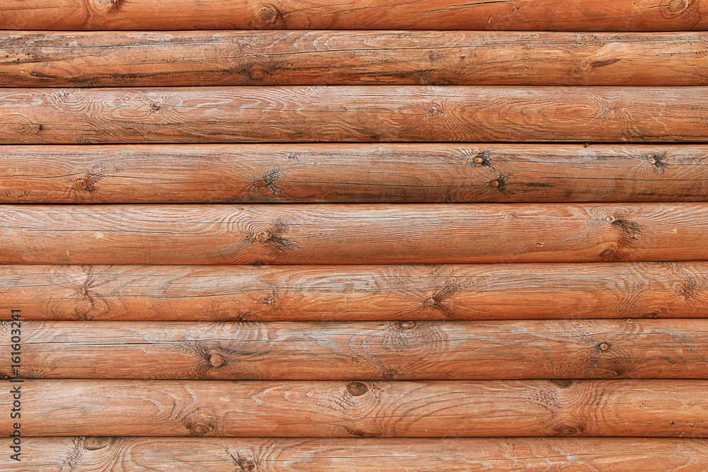 Obraz premium Wall of a wooden house from parallel logs
