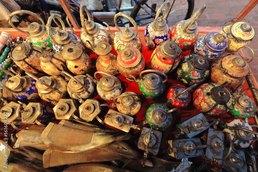 Fototapeta premium Enamel old teapots for sale-stall on Sakkaline road-Luang Prabang-Laos. 4514