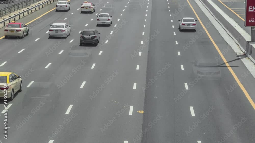 Big traffic on highway zayed in Dubai, UAE. Wide angle panorama from above carriageway. Six lanes of oncome way and two lanes at parallel way Big traffic on highway zayed in Dubai, UAE. Wide angle panorama from above carriageway. Six lanes of oncome way and two lanes at parallel way