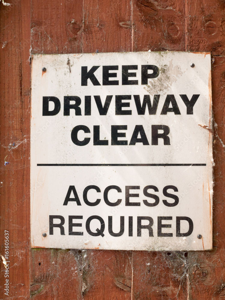 keep driveway clear no parking white and black sign board keep driveway clear no parking white and black sign board