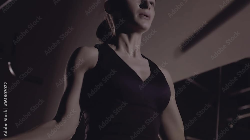 Low-angle shot of sporty young woman doing rope jumping. Low-angle shot of sporty young woman doing rope jumping.