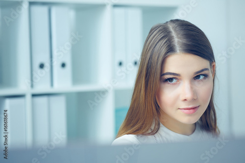 Close up portrait of young business woman look in  monitor display. Effective management, startup ambition, irc concept photo