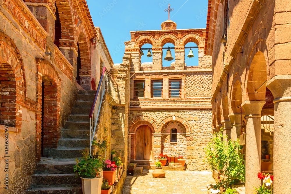 The courtyard area of Moni Agiou Ioanni Monastery Theotokou Ipsilou on the Greek island of Lesbos in the Aegean Sea.