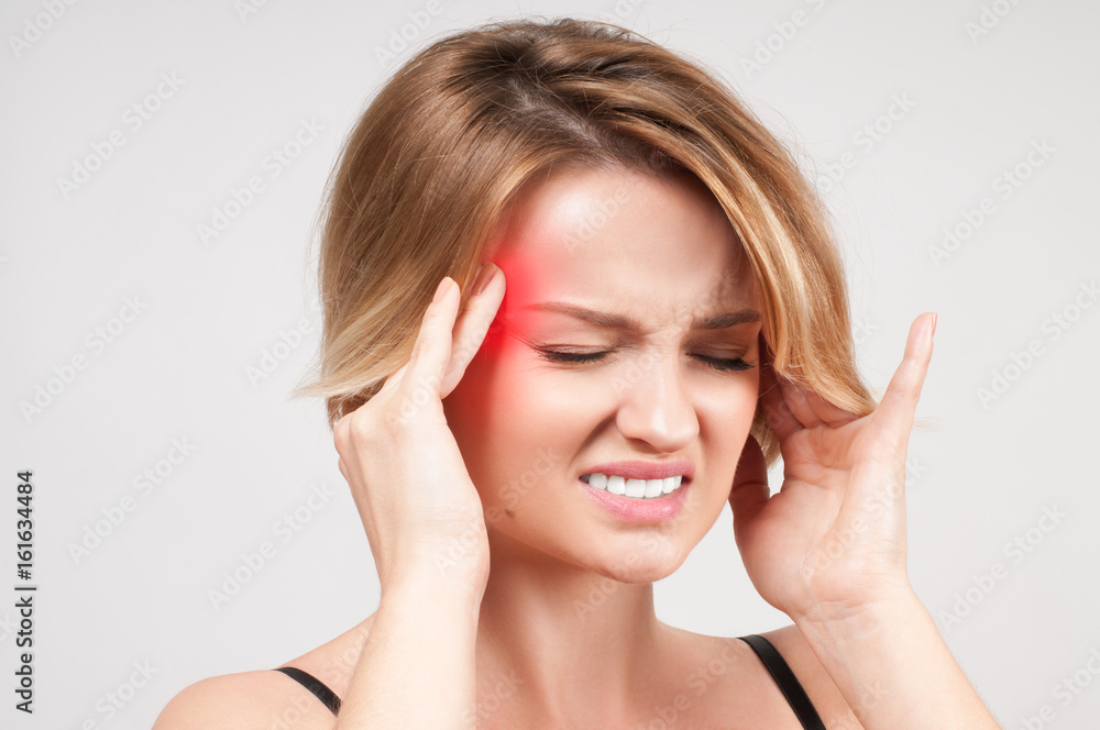 Woman having headache migraine Woman having headache migraine