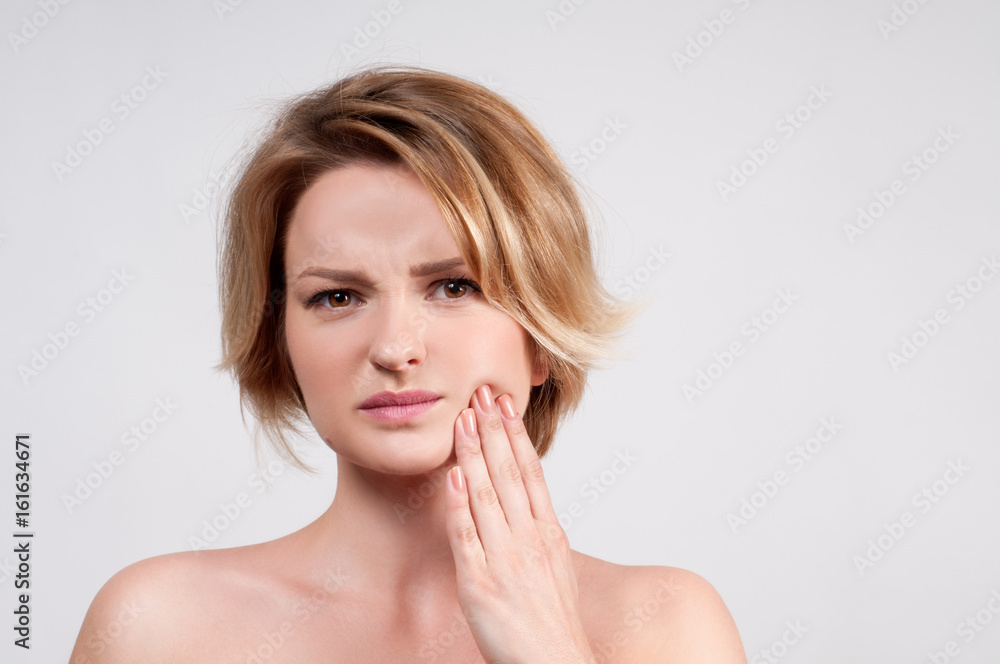 Closeup of woman suffering from toothache Closeup of woman suffering from toothache