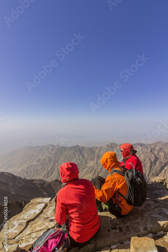 Toubkal national park, the peak whit 4,167m is the highest in the Atlas mountains and North Africa, trekkers relaxing and appreciating view.