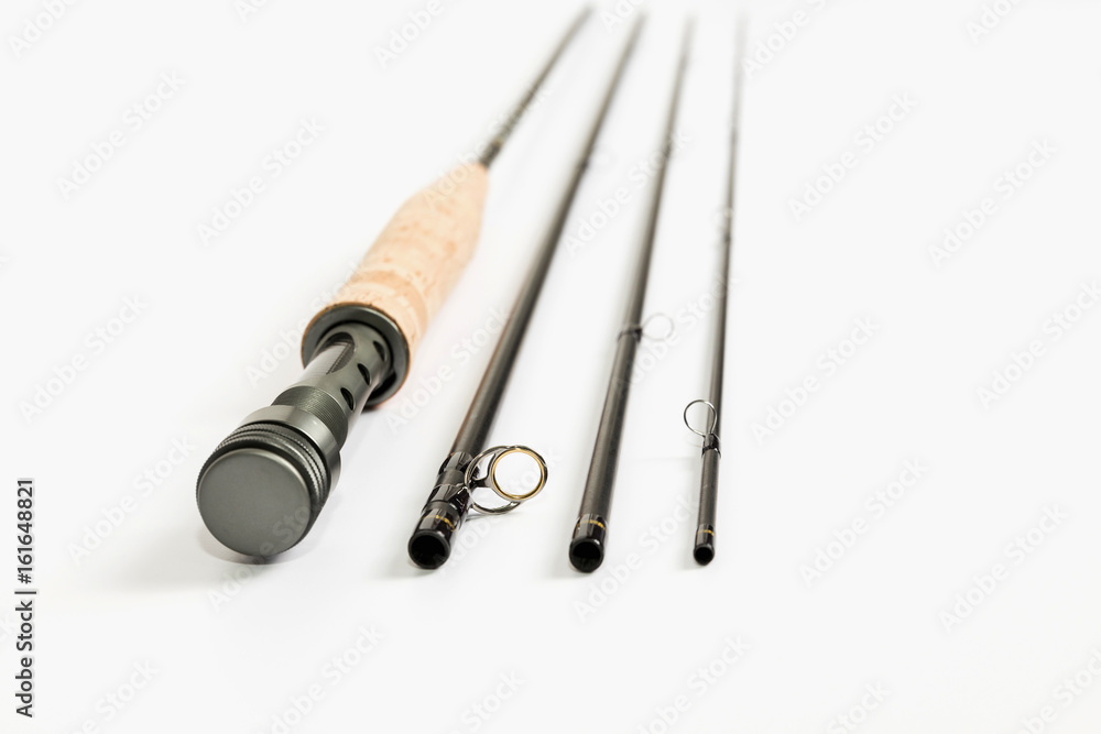A fly fishing rod on a white background. A fly fishing rod on a white background.