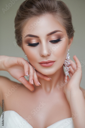 portrait of beautiful blonde bride with fashion hairstyle and make-up