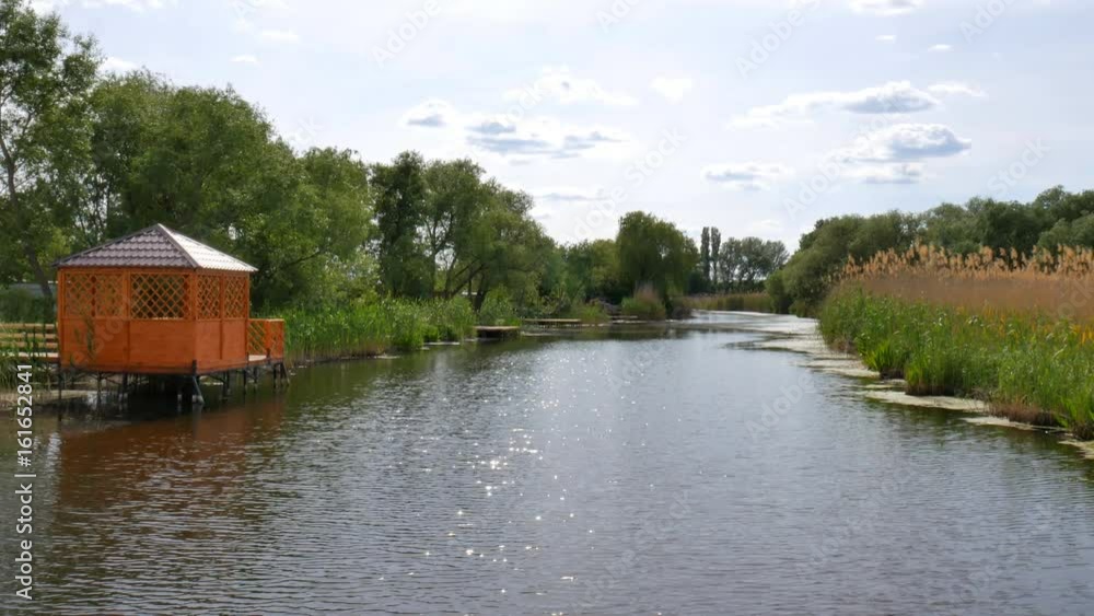 A wooden pergola on the river A wooden pergola on the river