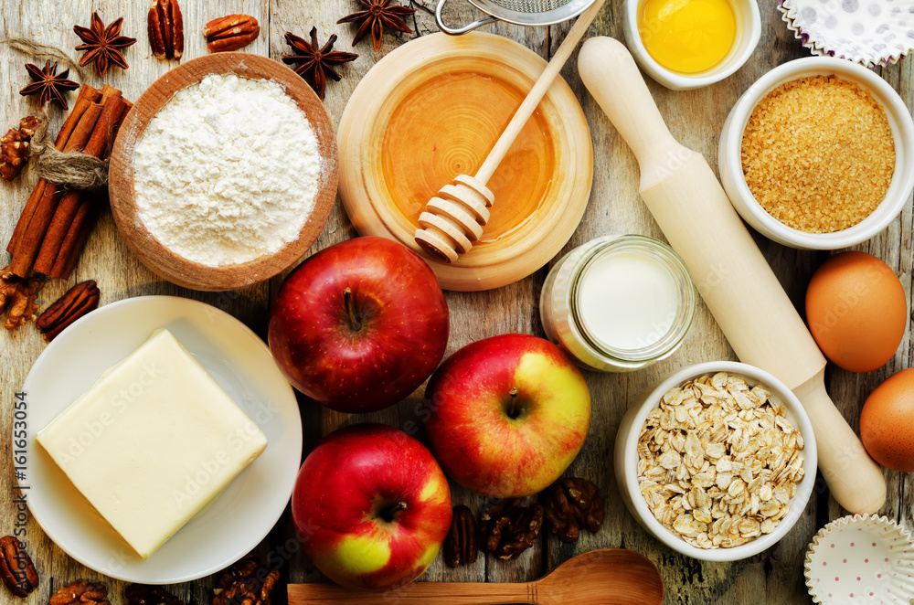 baking ingredients: apples, nuts, honey, flour and butter baking ingredients: apples, nuts, honey, flour and butter