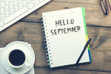 hello september text on notepad