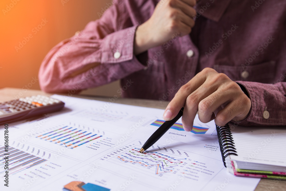 People check profit fund graph about cost at home ,Finance managers task,Concept business and finance People check profit fund graph about cost at home ,Finance managers task,Concept business and finance
