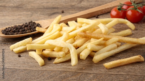 фотографія French fries on a wooden background