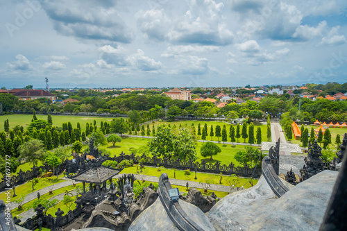 BALI, INDONESIA - MARCH 08, 2017: Panoramic landscape traditional balinese hindu temple Bajra Sandhi monument in Denpasar, Bali, Indonesia on background tropical nature and blue summer sky, Indonesia photo