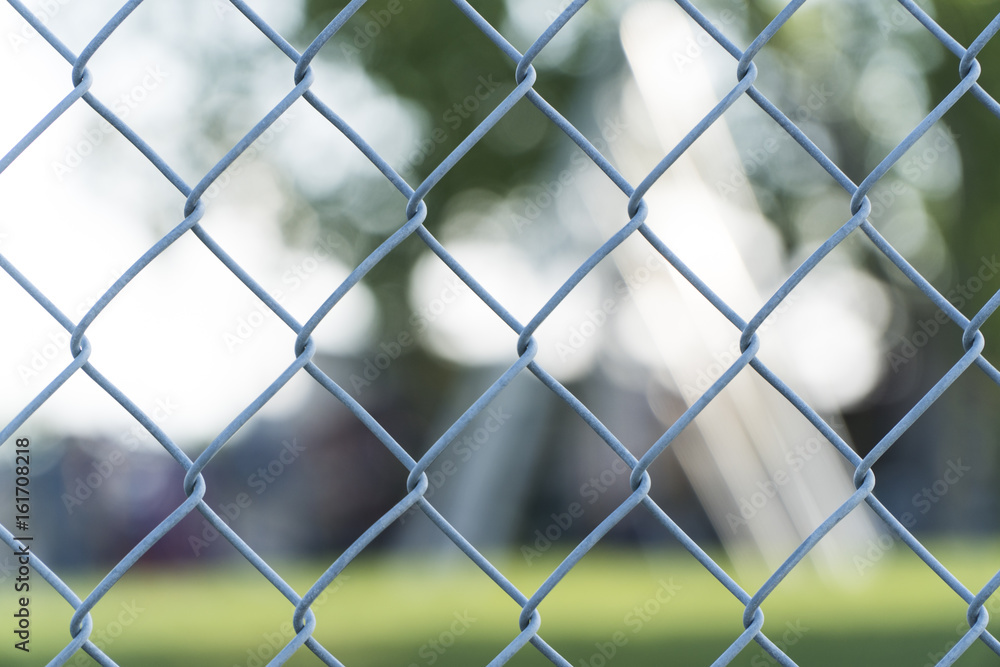Chain link wire fence background in public park Chain link wire fence background in public park