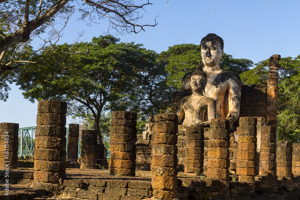 Two old sculpture buddha and sunlight at Wat Phra Si Ratanamahathat  in Sisatchanalai Historical Park, Sukhothai province Thailand
