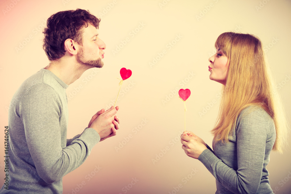 Loving pare with hearts flirting. Loving pare with hearts flirting.