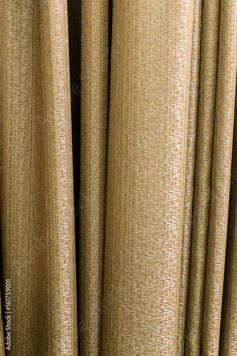Curtain. Shooting at close range. The texture of the fabric is visible. Color gold.