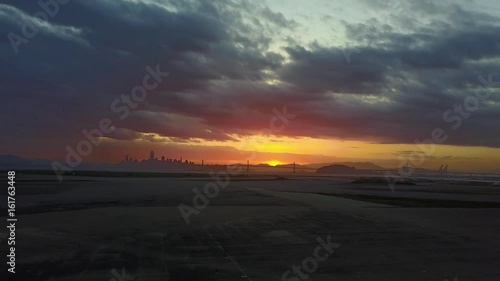 Drone shot looking at San Francisco from Alameda at sunset