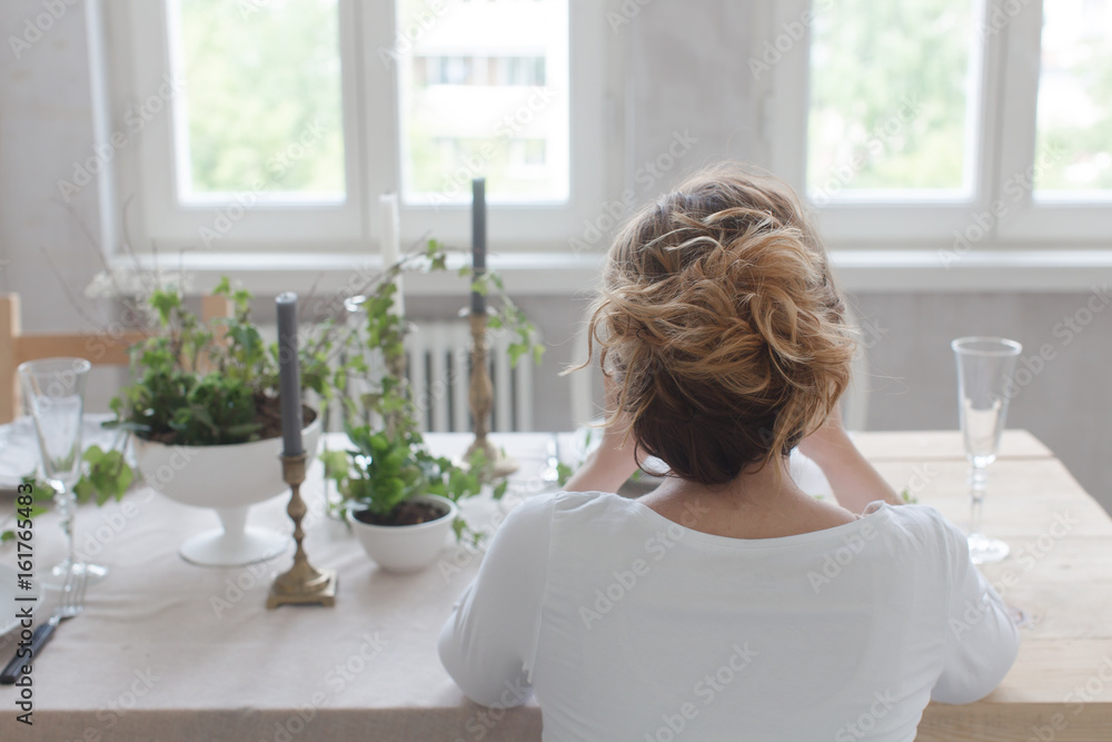 Woman sitting at table Woman sitting at table