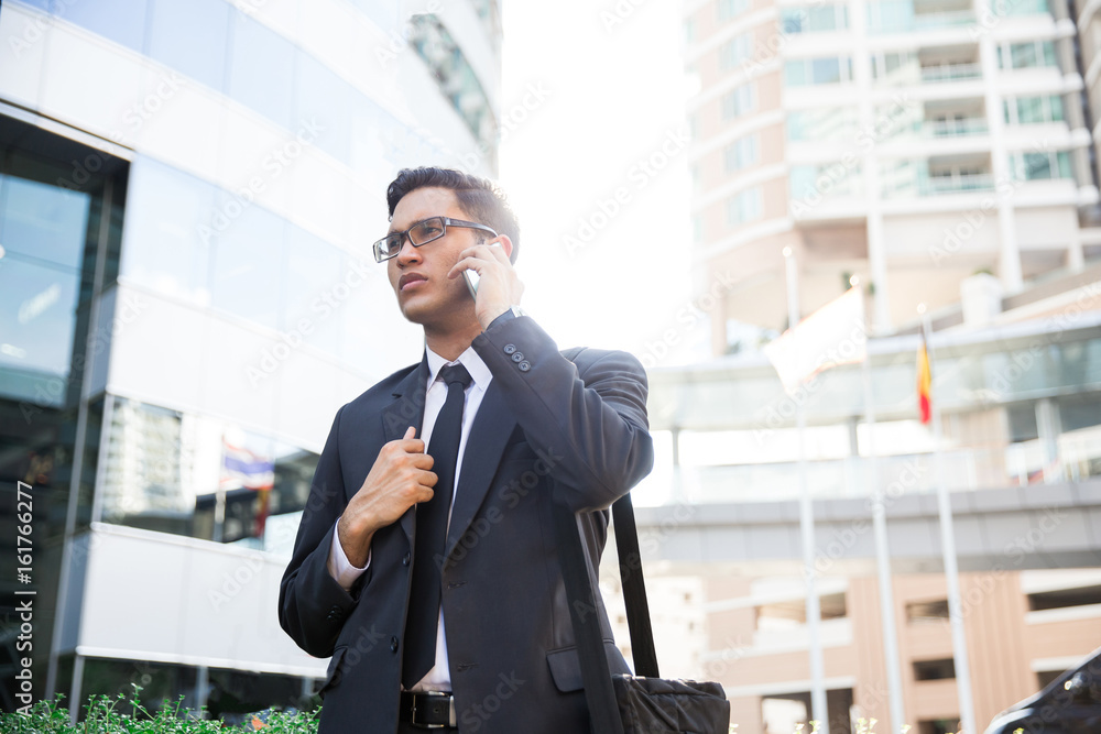 Young asian businessman outdoors Young asian businessman outdoors