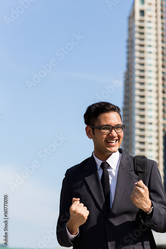Young asian businessman outdoors